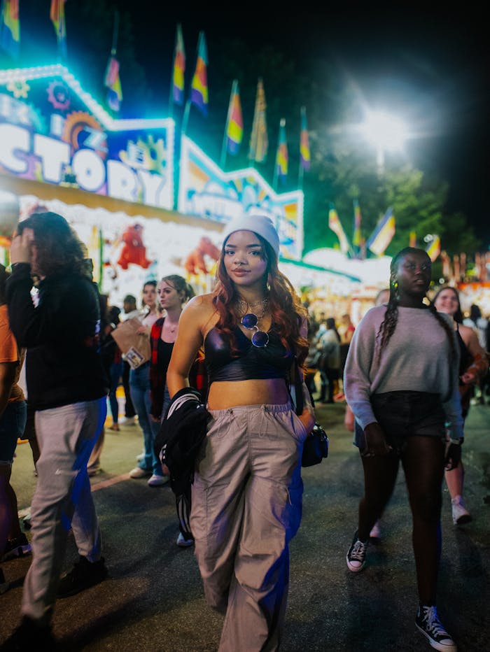 Young adults enjoying a vibrant night festival in Atlanta, Georgia.